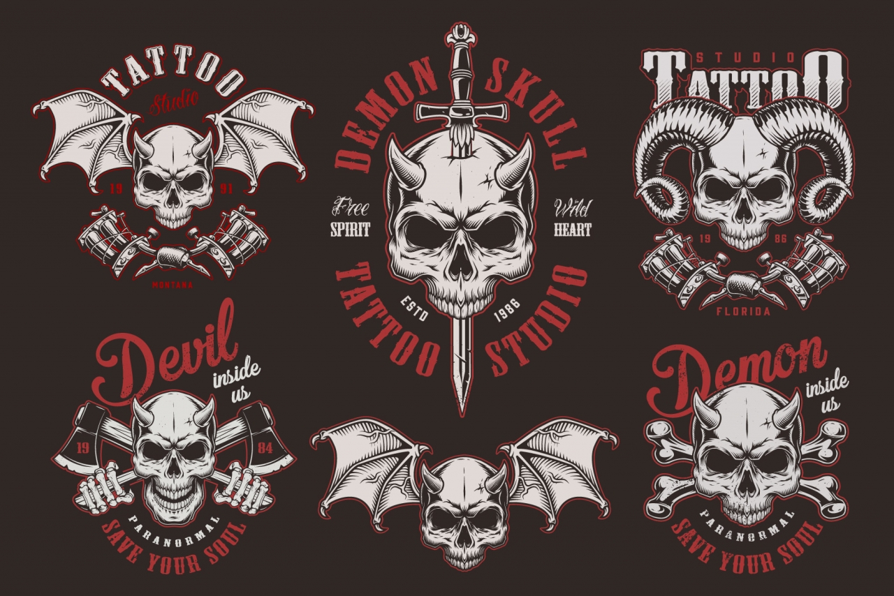 Vintage demon skull tattoo labels with sword, crossbones, axes, tattoo machines and sword on dark background