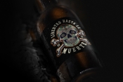 Vintage colorful Dia De Los Muertos packaging design template of bottle with sugar skull and crossbones label